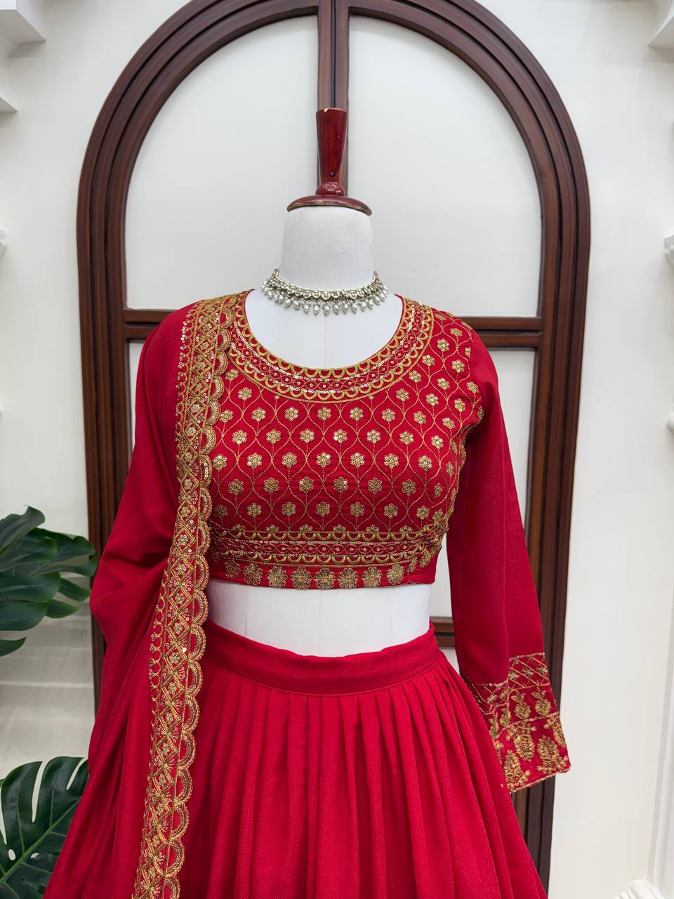 Classic Crimson Red Bridal Lehenga Choli Featuring Opulent Gold Zari Embroidery and Scalloped Borders